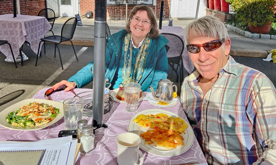 Carol de Giere and Stephen Schwartz discussing opening numbers over lunch