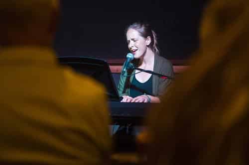 Elle Tyler performing at piano