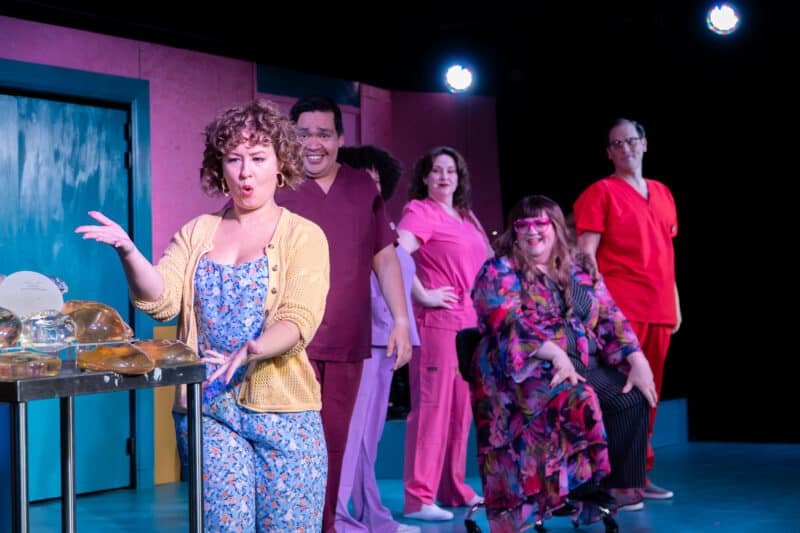 a scene from the musical cleaVage, featuring the cast and actual breast implants